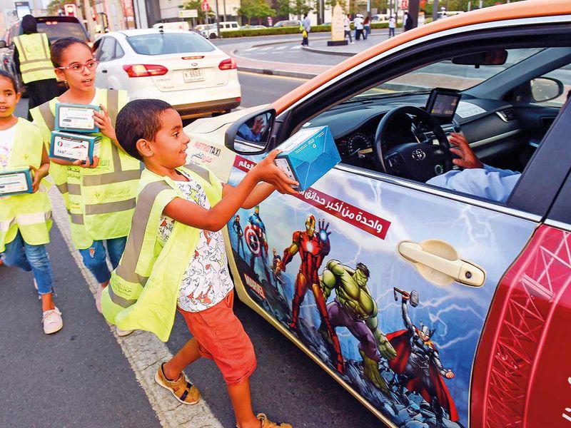 [Young volunteers from Al Ihsan Charity Association distributing Iftar packs to motorists at a traffic signal near City Walk. Virendra Saklani/Gulf News]
The Expat-ations